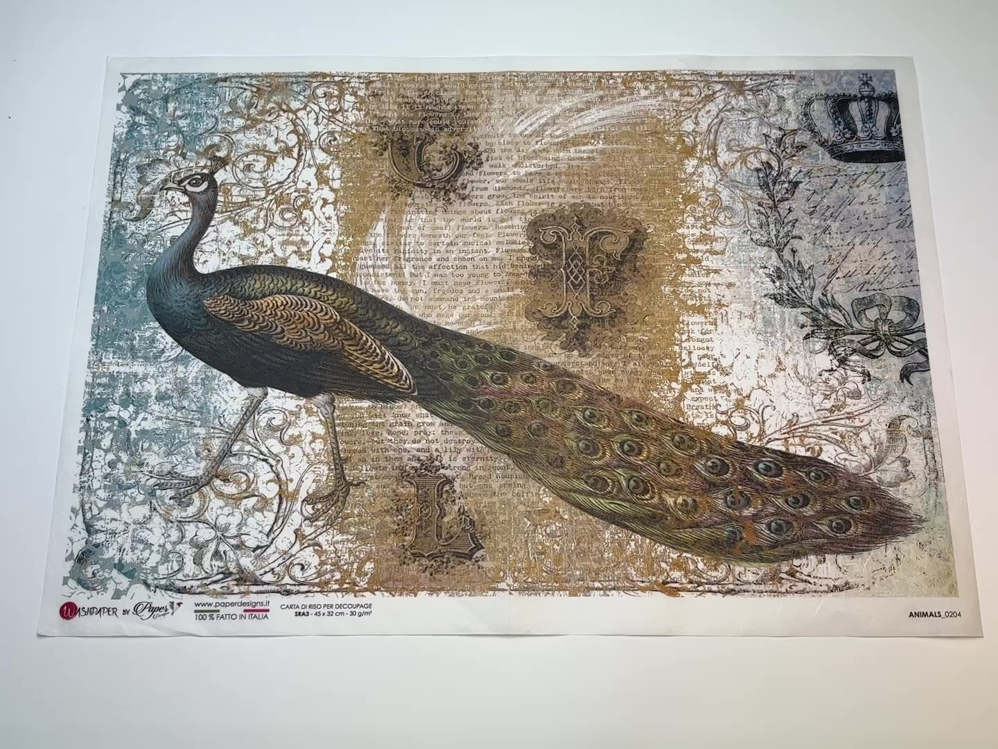 A 13 second video of a close-up and backside of Decoupage Queen's Elegant Peacock A3 rice paper is against a white background.