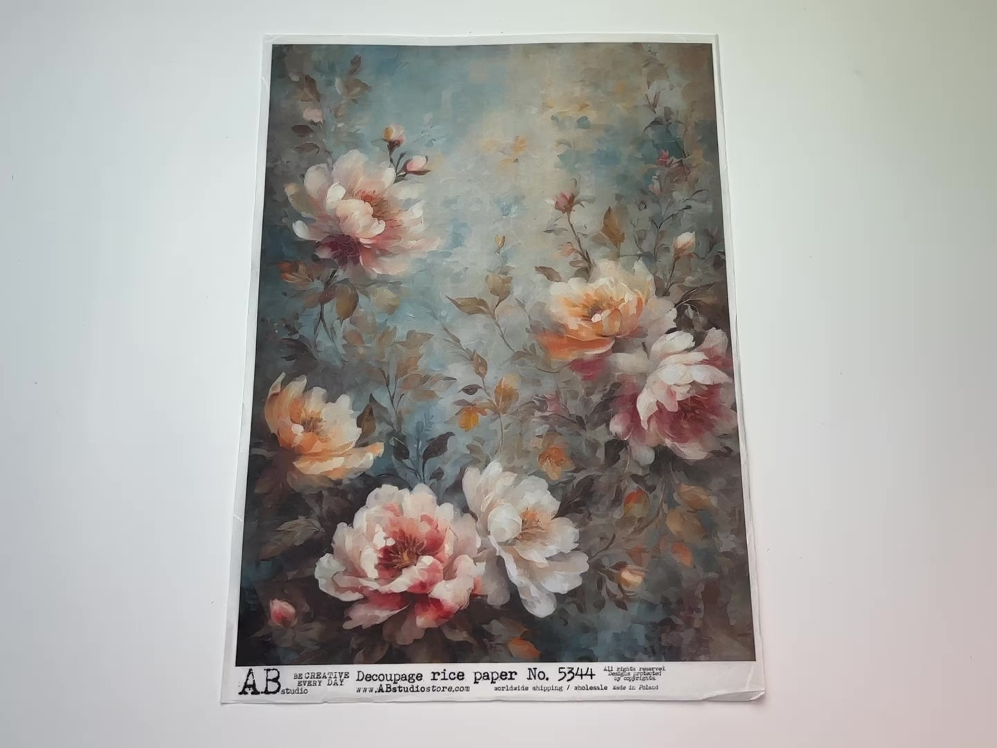 A 14 second video showing a close-up and backside of AB Studio's Pink and Yellow Florals A4 rice decoupage paper is against a white background.