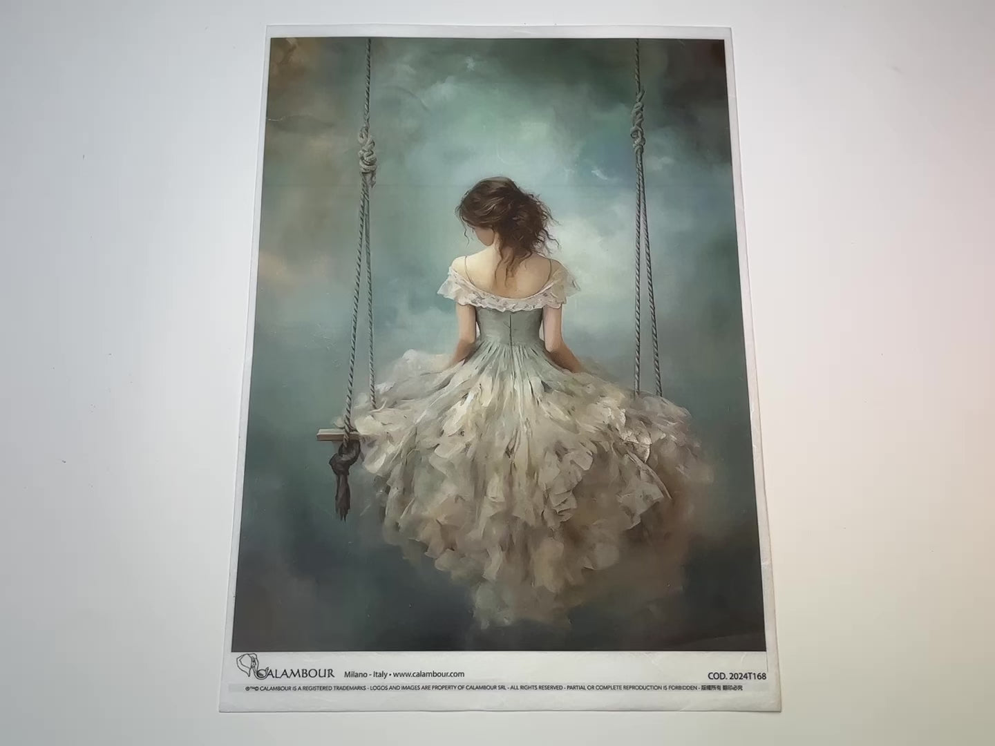 A 14 second video shows a close-up and backside of Calambour Italy's Dreamscape Girl on Swing rice paper against a white background.