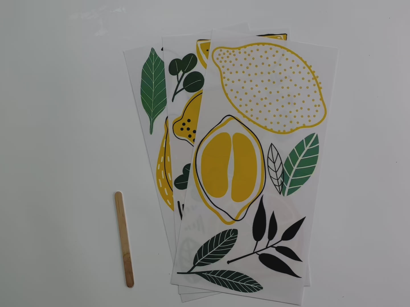 A 14 second video shows a close-up of 3 sheets of ReDesign with Prima's Lemon small rub-on transfer.