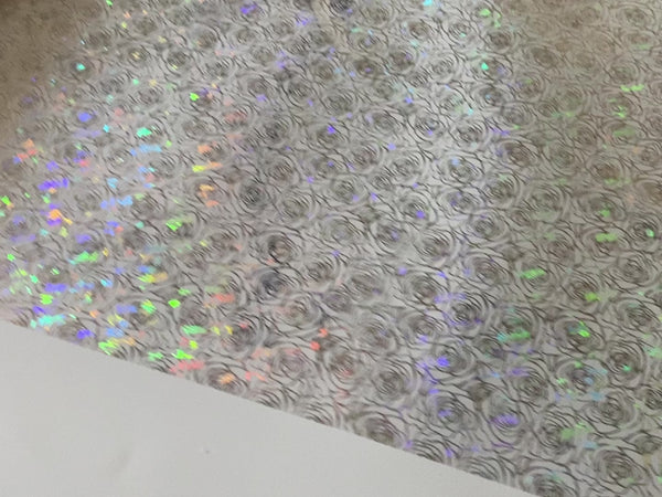 An 11 second video shows a close-up view showcasing a colorful holographic repeating rose pattern of Artistic Painting Studio's Monroe Hologram Foil Transfer 