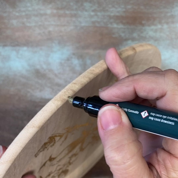 An 8 second video showing how to use ReDesign with Prima's gold metallic paint marker on the outer edge of a wood Paulownia charger.