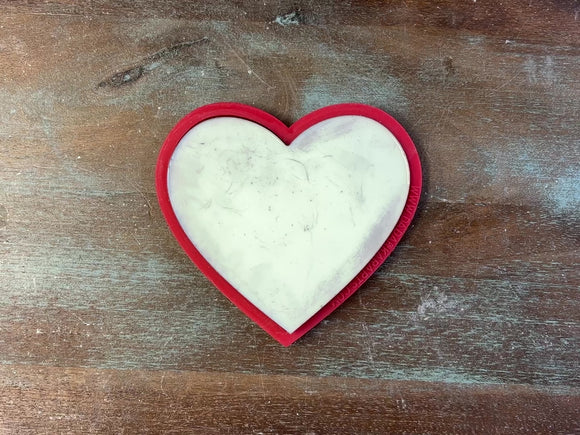 An 11 second video shows a close-up of a Get Inspired by Dadarkar Art's Druzy Heart silicone mold. A hand is shown picking up a silver colored casting from the mold.