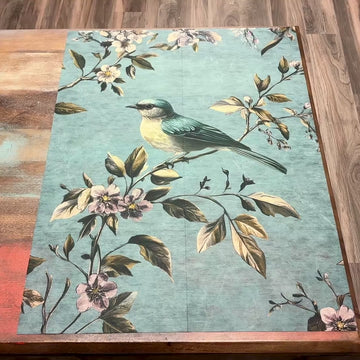 A 10 second video shows a close-up of ReDesign with Prima's Blue Song A1 fiber paper against a wood background.