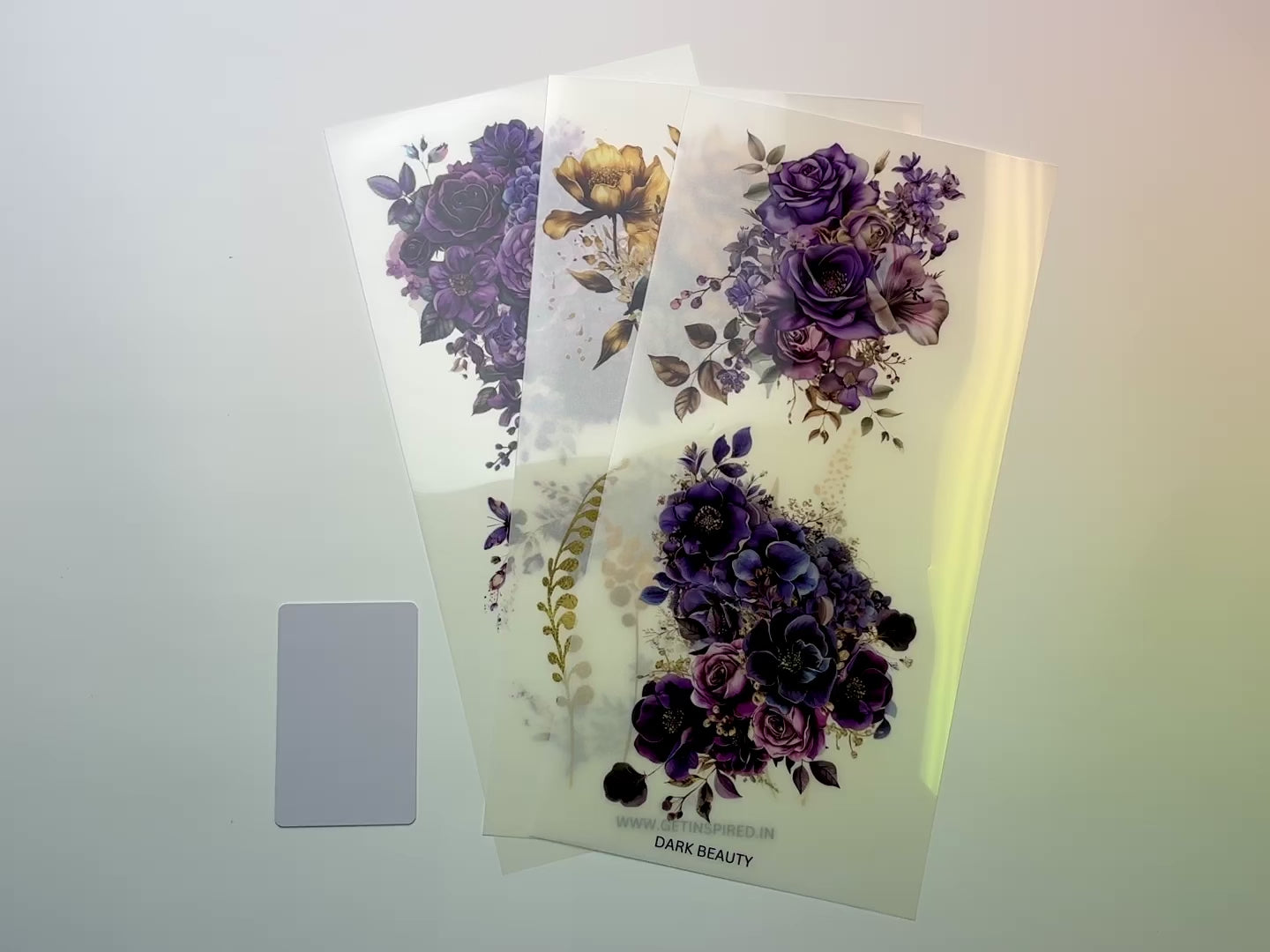 A 15 second video shows a close-up and backside of 3 sheets of Dadarkar Art's Get Inspired Dark Beauty rub-on transfers against a white background.