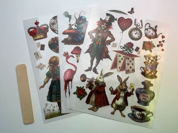 A 13 second video shows a close-up and backside of 3 sheets of ReDesign with Prima's Whimsical Realm middy transfers.