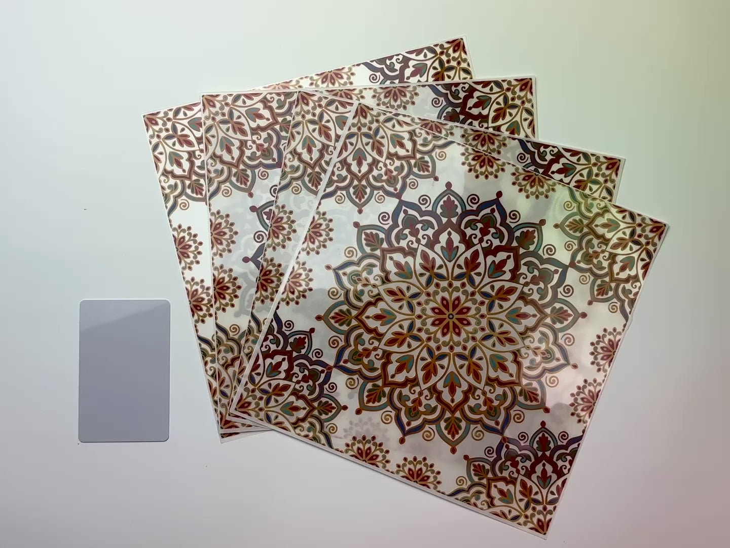 A 15 second video shows a close-up and backside of 4 sheets of Dadarkar Art's Get Inspired Arabian Mandala rub-on transfers against a white background.