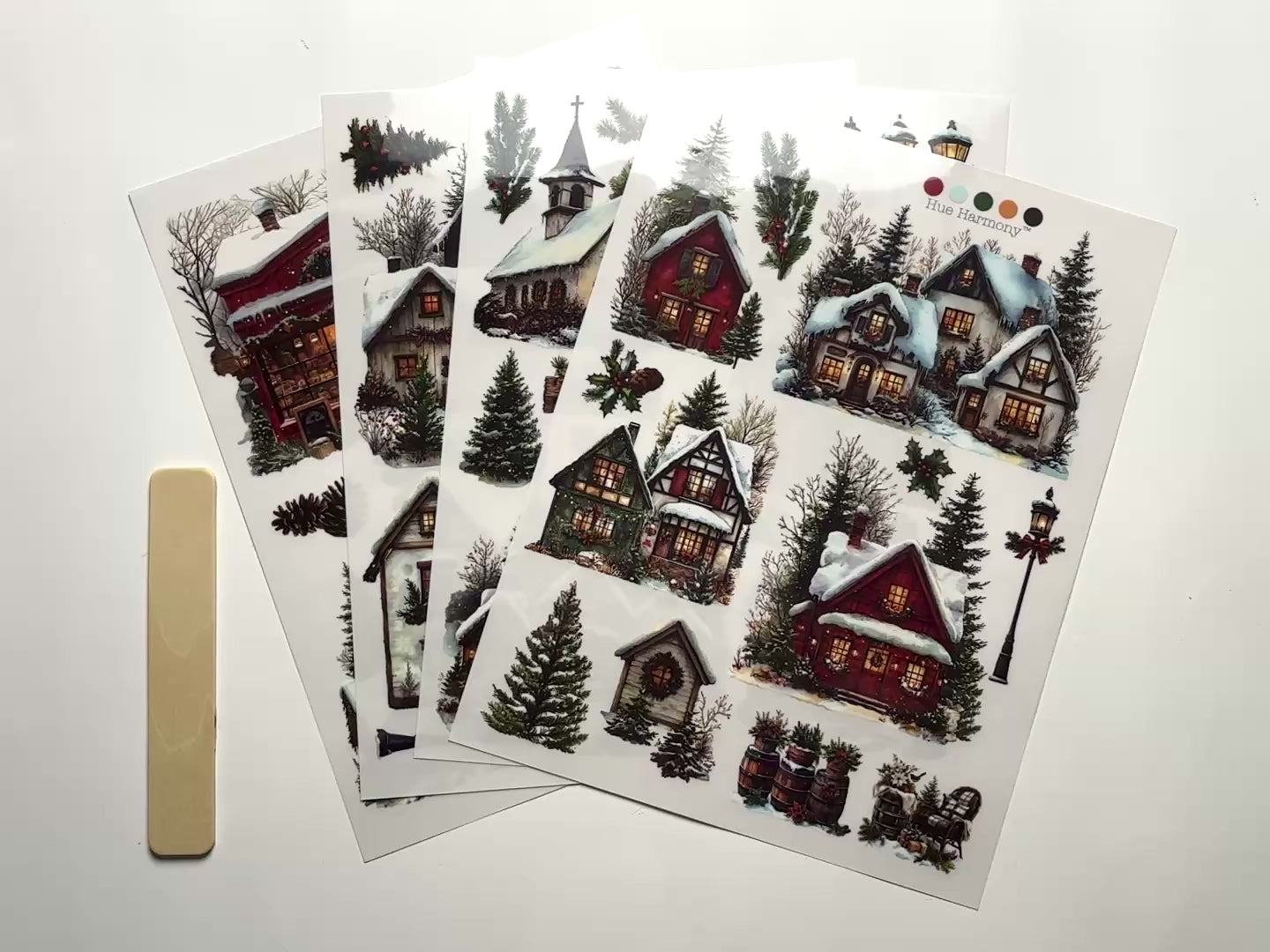 A 14 second video shows a close-up and backside of 4 sheets of ReDesign with Prima's Village of Wonder middy rub-on transfers against a white background.