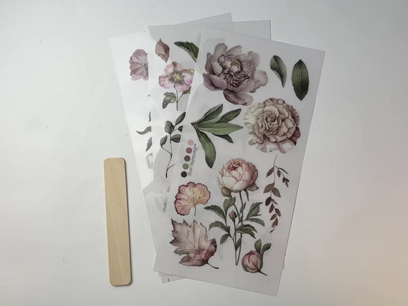 A 14 second video shows a close-up and backside of 3 sheets of ReDesign with Prima's Blossom Breeze small rub-on transfers against a white background.