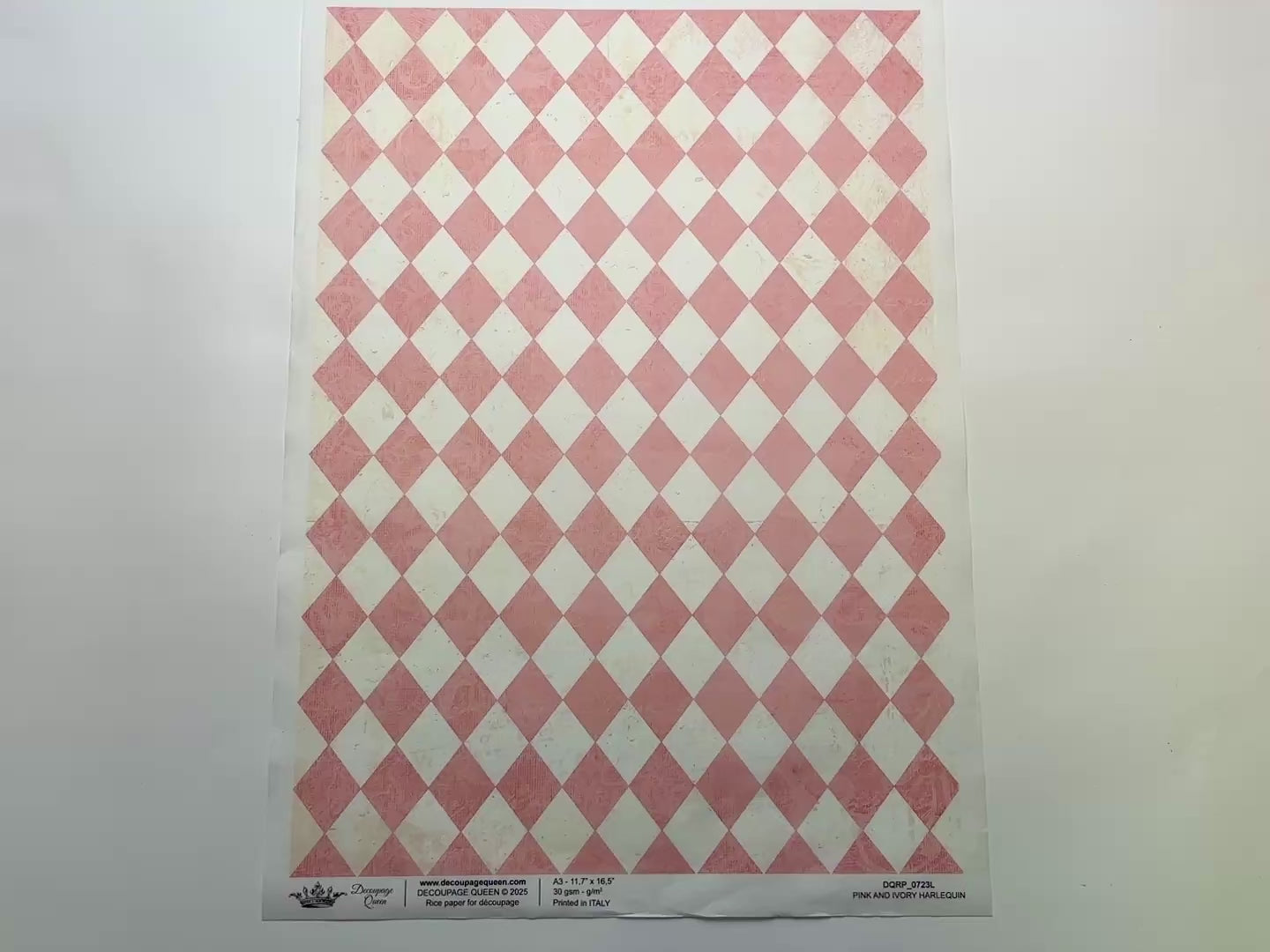 A 14 second video shows a close-up and backside of Decoupage Queen's Pink and Ivory Harlequin A3 rice paper against a white background.