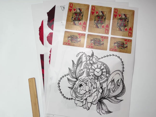 A 14 second video shows a close-up of 4 sheets of Belles & Whistles' Roses are Red rub-on transfer are against a white background.