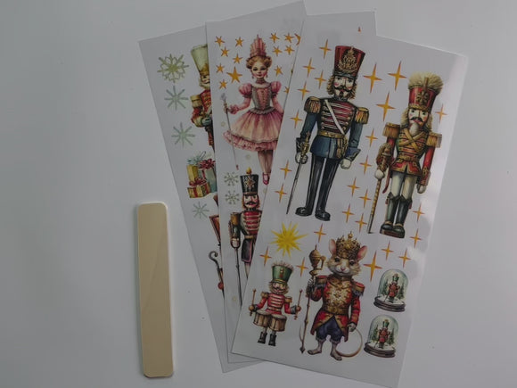 A 14 second video shows a close-up of 3 sheets of ReDesign with Prima's Nutcracker Christmas small rub-on transfer.