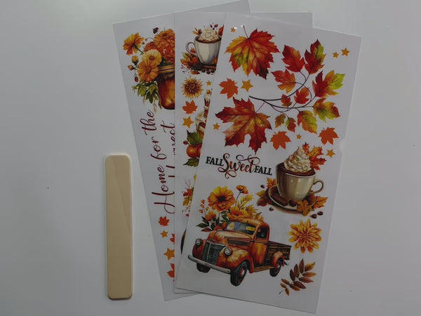 A 14 second video shows a close-up of 3 sheets of ReDesign with Prima's Autumn Splendor small rub-on transfer.