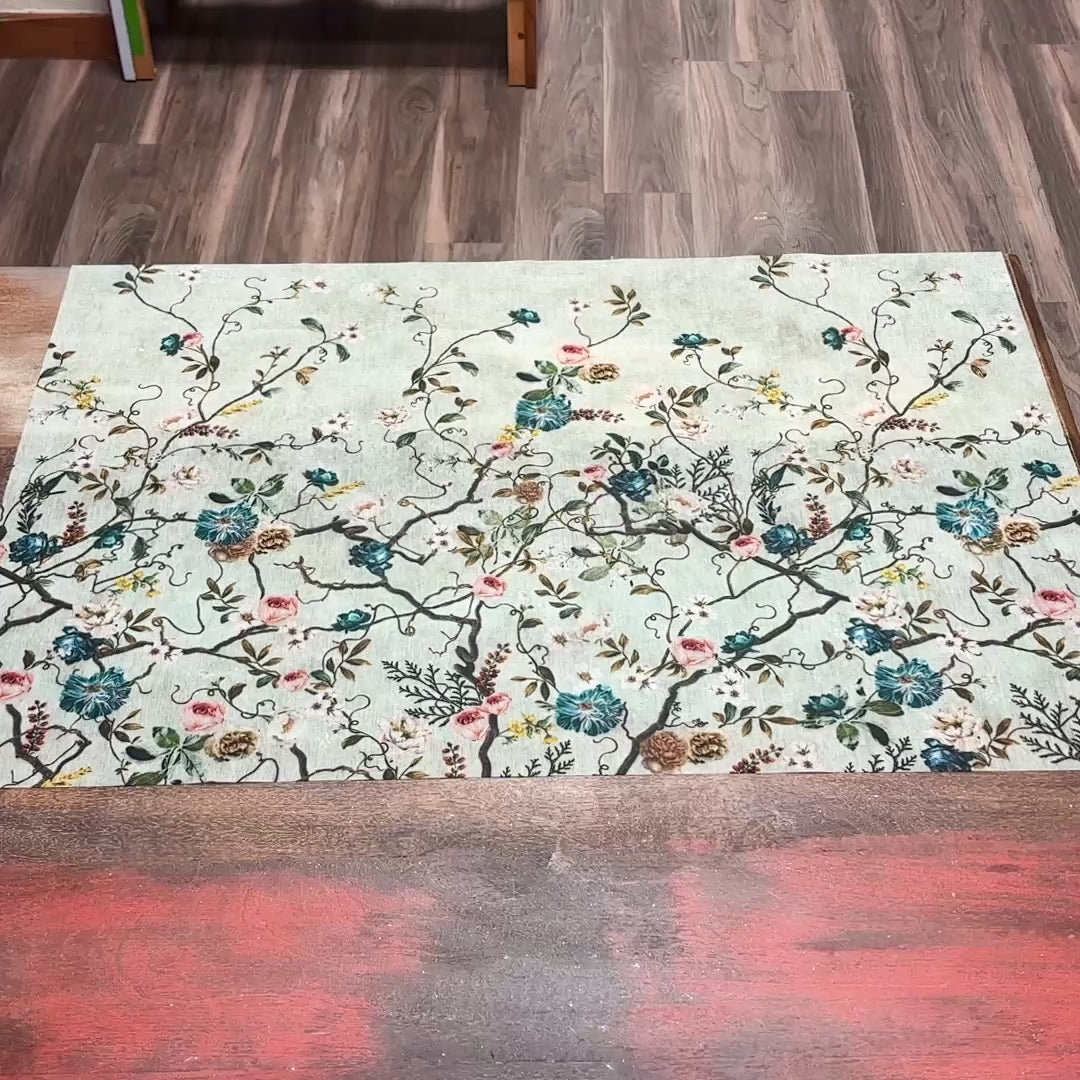 An 11 second video shows a close-up of ReDesign with Prima's Blossom Perch A1 fiber paper against a wood background.
