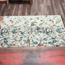 An 11 second video shows a close-up of ReDesign with Prima's Blossom Perch A1 fiber paper against a wood background.