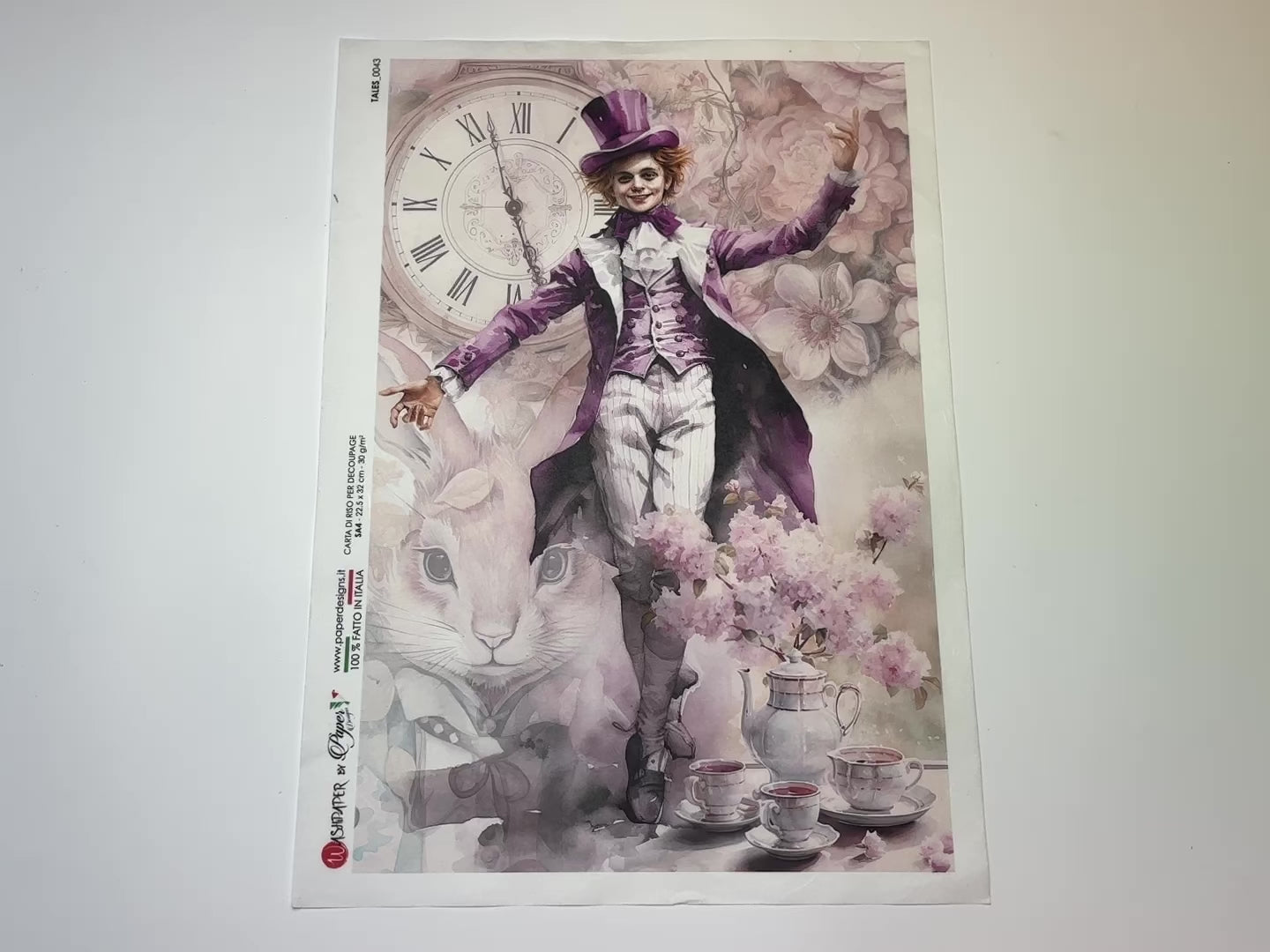 A 14 second video of a close-up and backside of Paper Designs Italy's The Mad Hatter Tales A4 rice paper is against a white background.