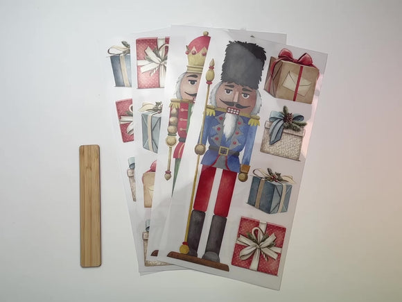 A 15 second video shows a close-up of 4 sheets of Belles & Whistles' Nutcracker rub-on transfer.