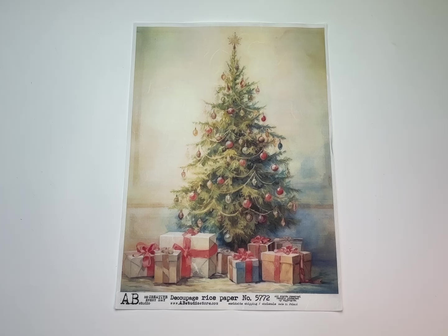 A 13 second video showing a close-up and backside of AB Studio's Christmas Tree with Wrapped Presents A4 rice decoupage paper is against a white background.