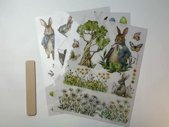 A 14 second video shows a close-up and backside of 3 sheets of ReDesign with Prima's Bunny Trails small rub-on transfers against a white background.