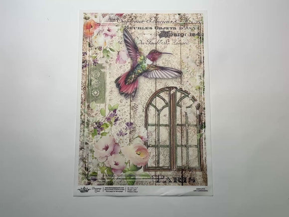 A 14 second video shows a close-up and backside of Decoupage Queen's Airy Hummingbird A4 rice paper against a white background.