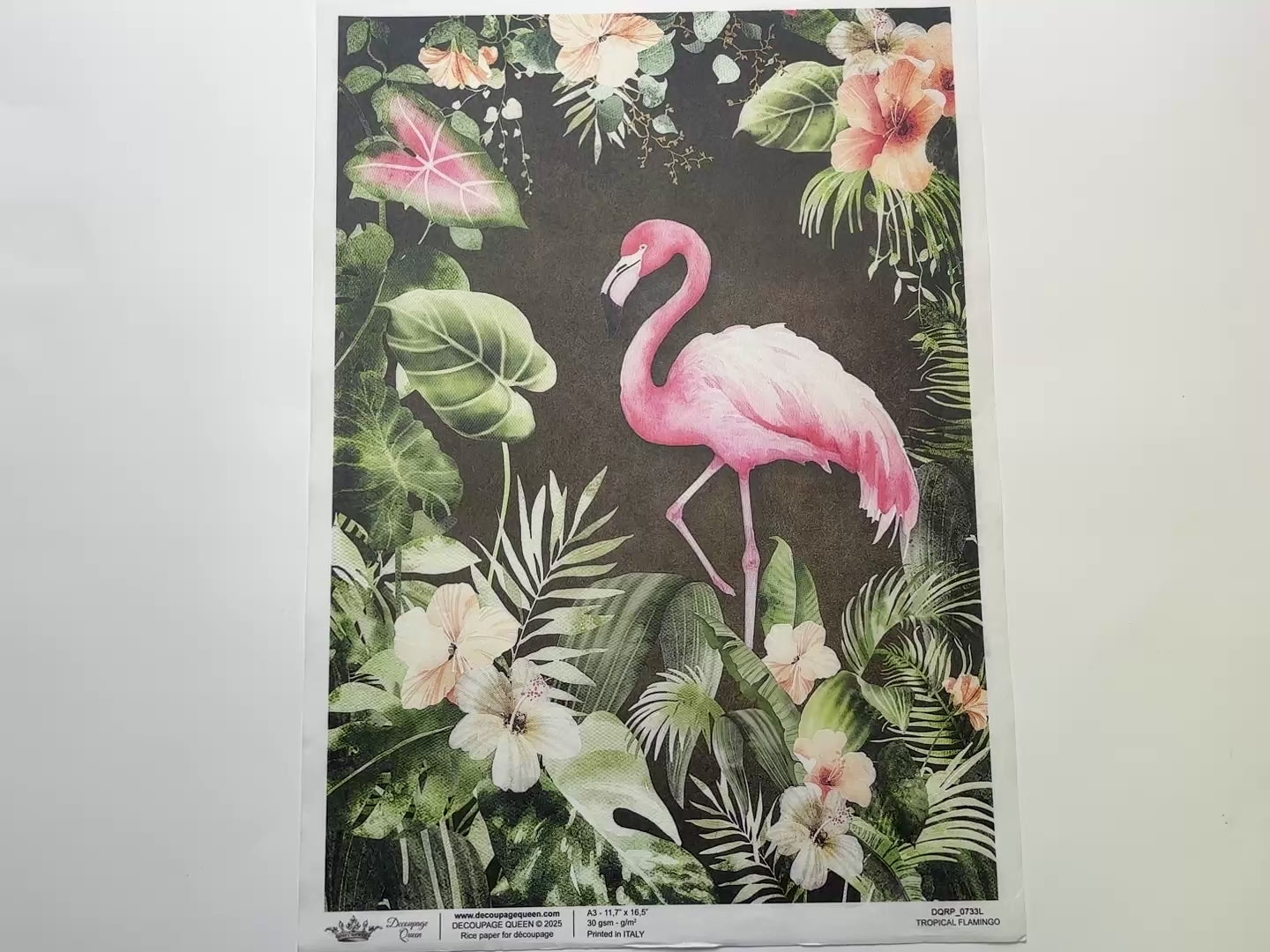 A 14 second video shows a close-up and backside of Decoupage Queen's Tropical Flamingo A3 rice paper against a white background.