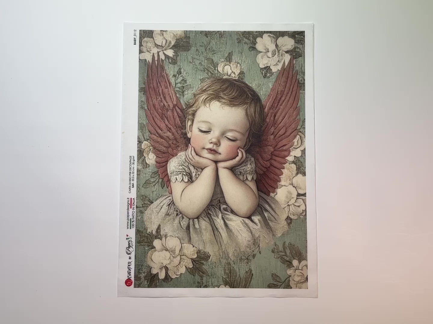 A 14 second video shows a close-up and backside of Paper Designs Italy's Dreaming Angel Baby A4 rice paper against a white background.