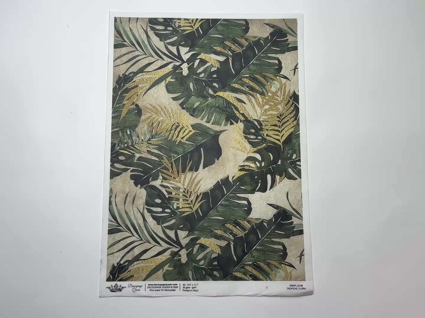 A 14 second video shows a close-up and backside of Decoupage Queen's Tropical Flora A4 rice paper against a white background.