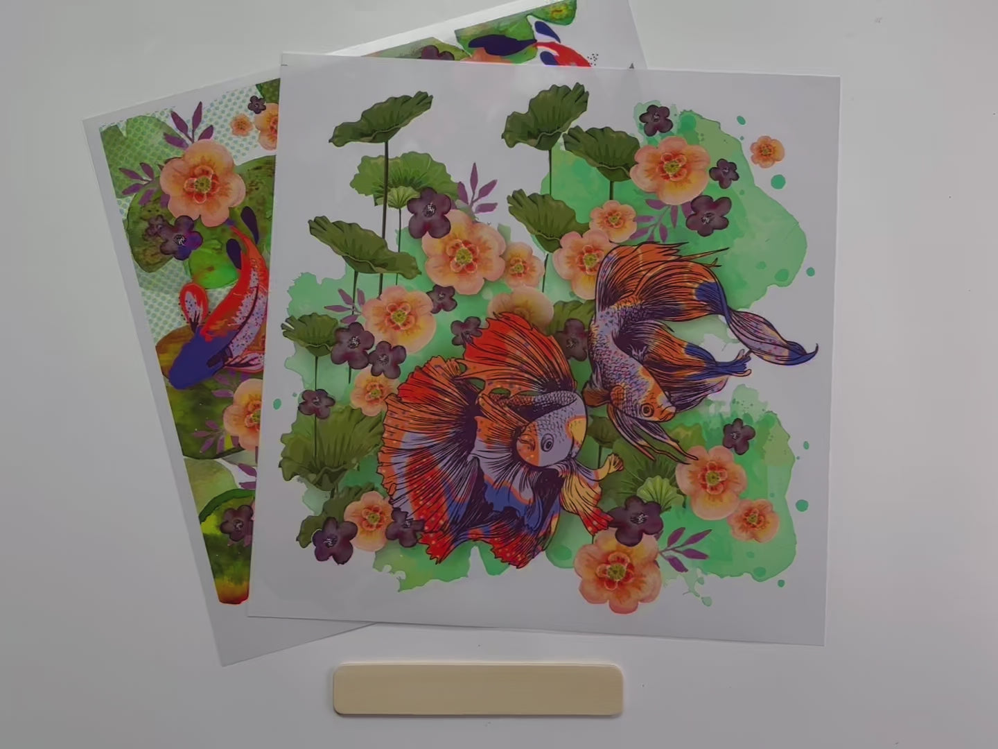 A 14 second video shows a close-up of ReDesign with Prima's Siamese Splendor 12" x 12" small transfer.