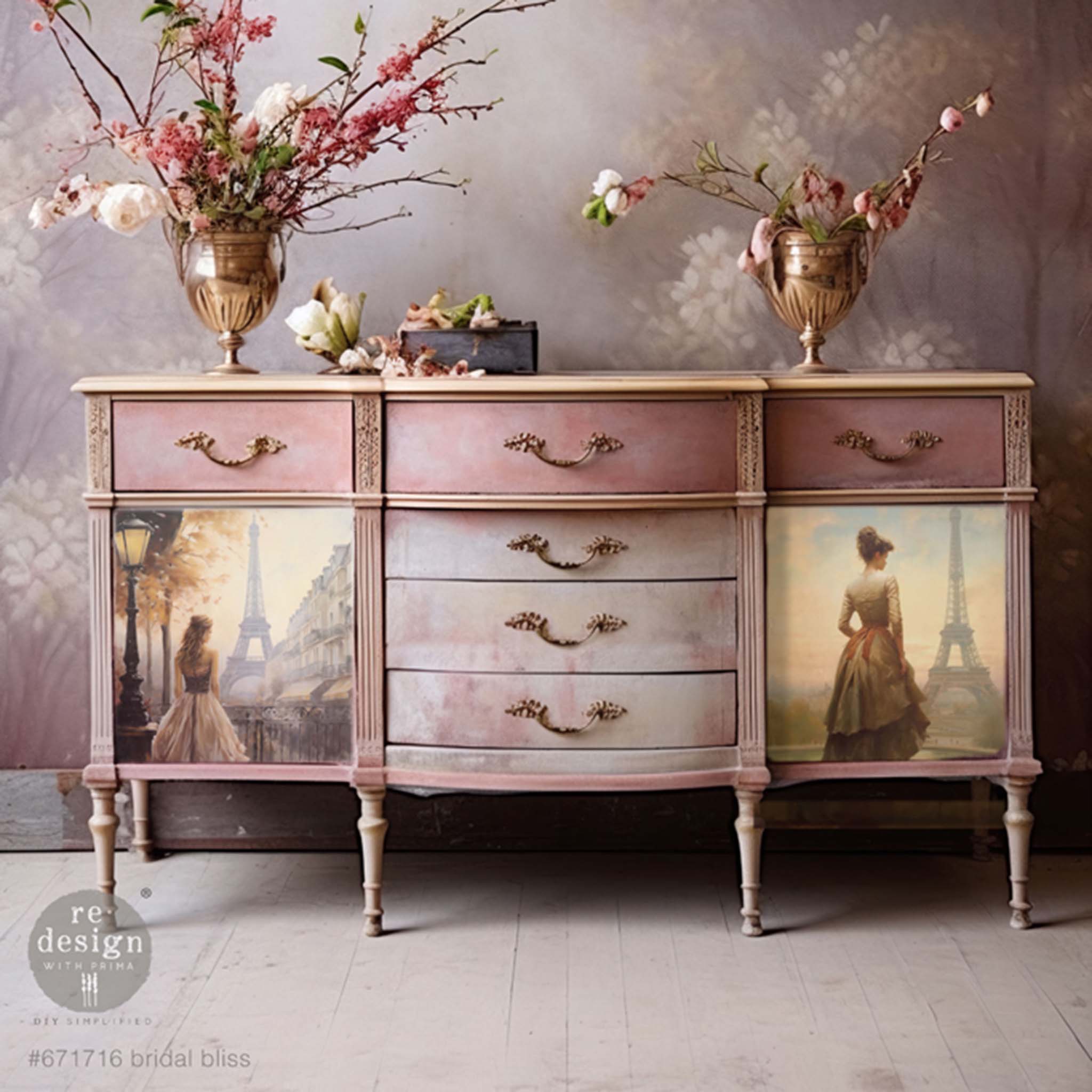 A vintage dresser is painted different shades of light pink and feature ReDesign with Prima's Bridal Bliss tissue paper on 2 doors located on the front.