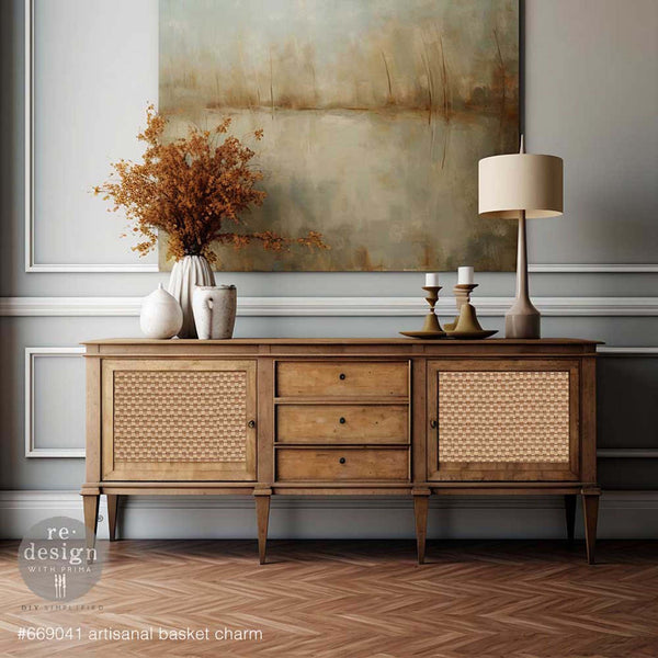 A vintage natural wood tv console table that features ReDesign with Prima's Artisanal Basket Charm A1 fiber paper on its 2 doors.