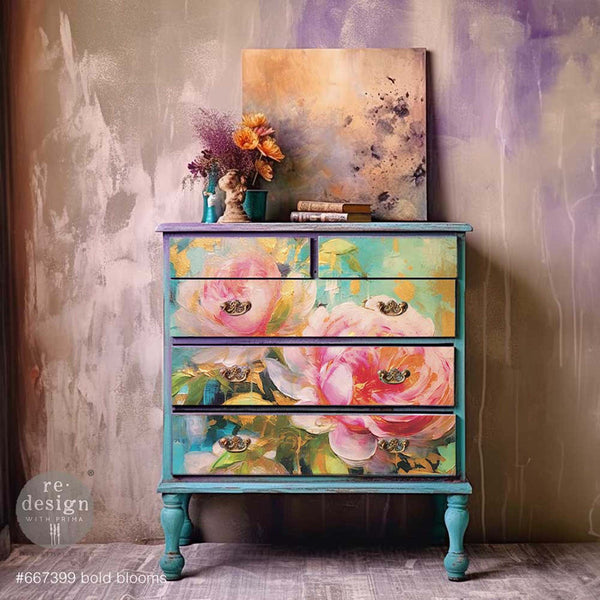 An antique dresser is painted a blend of teal and purple and features ReDesign with Prima's Bold Blooms A1 fiber paper on its 5 drawers.