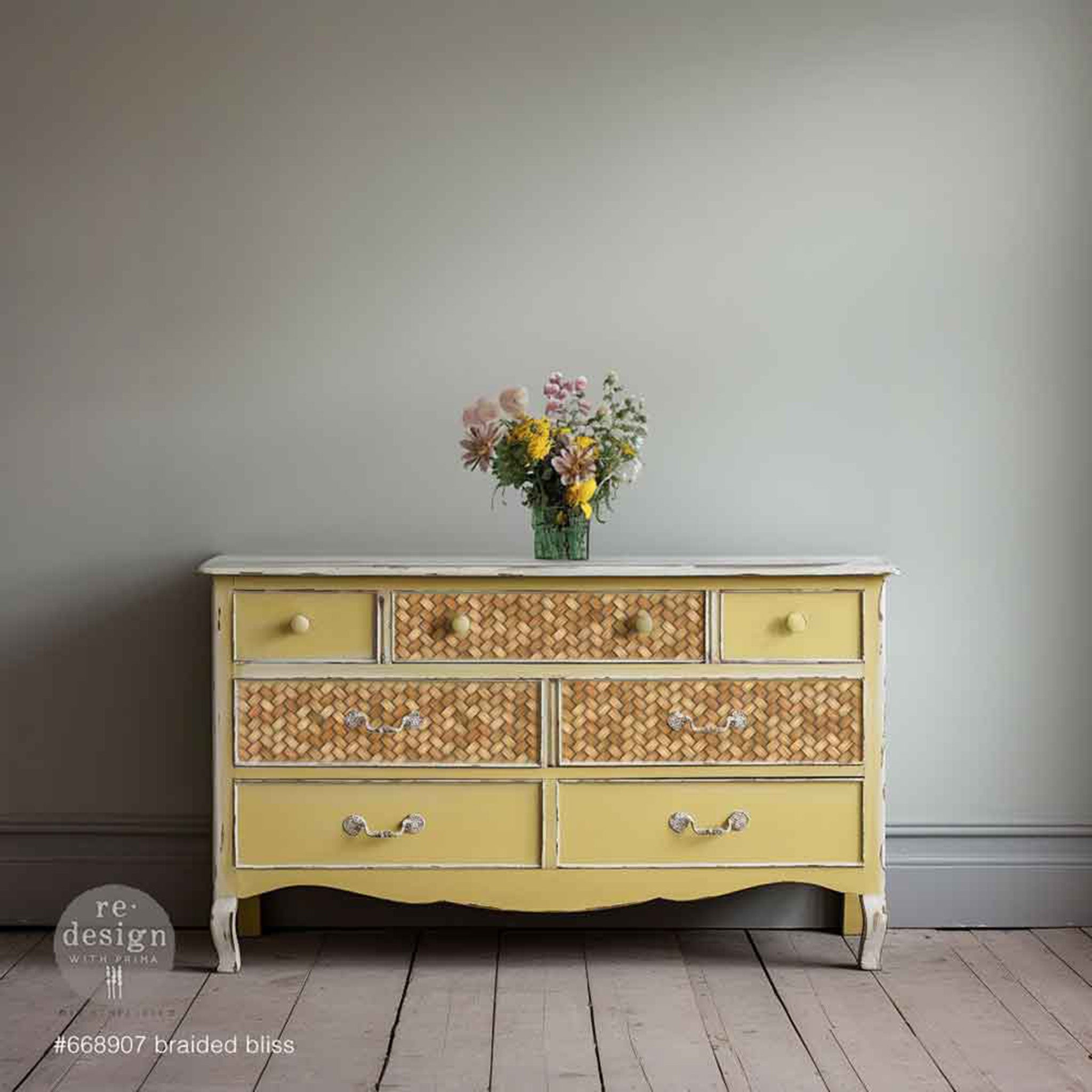 A vintage 7-drawer dresser is painted pale yellow and features ReDesign with Prima's Braided Bliss fiber paper on 3 of the drawers.