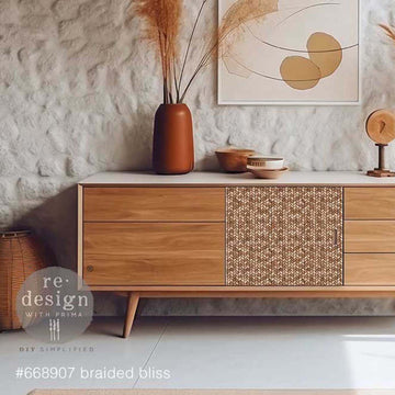 A mid-century TV consol or dresser is painted partially white with natural wood and features ReDesign with Prima's Braided Bliss A1 fiber paper on the front center between its drawers.