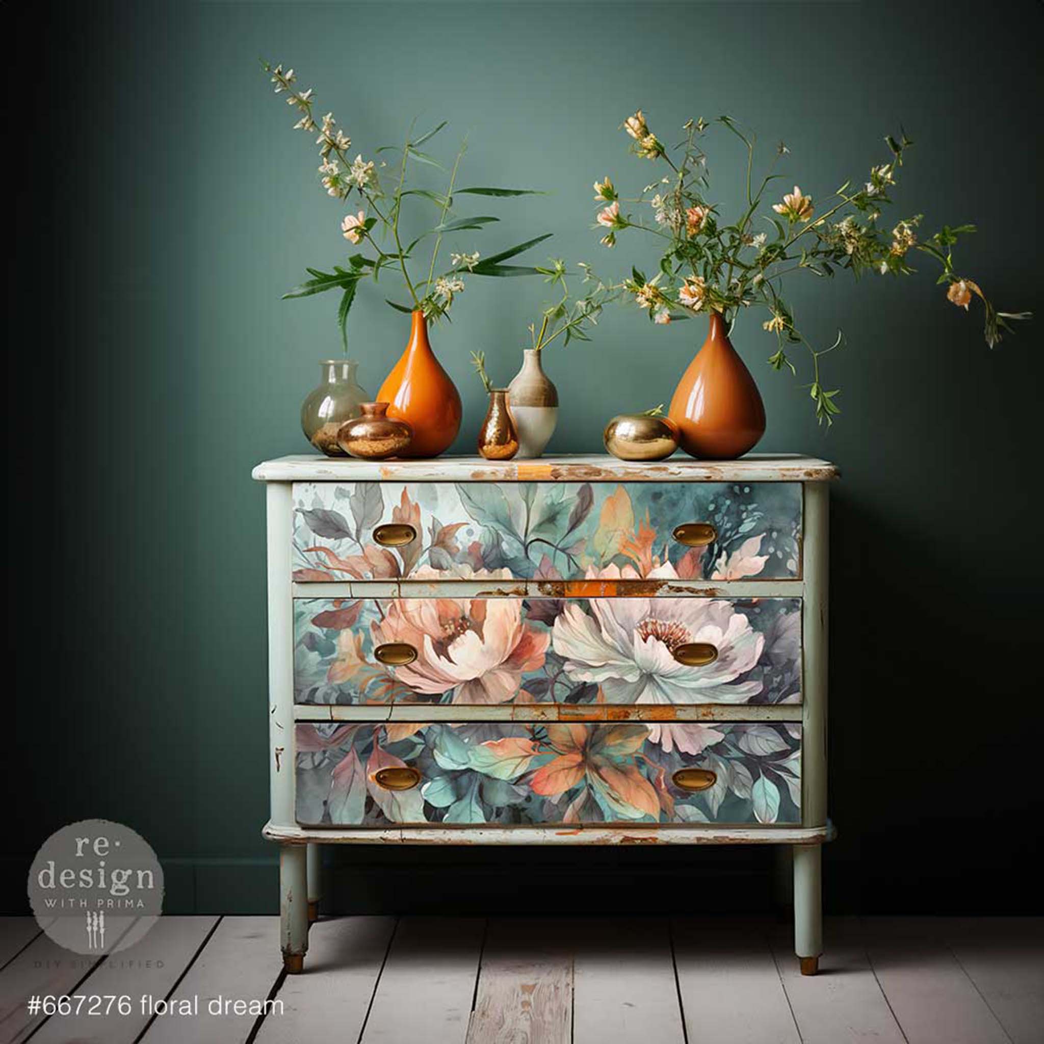 A dresser is painted a weathered pale green and features ReDesign with Prima's Floral Dream A1 fiber paper on its 4 drawers.