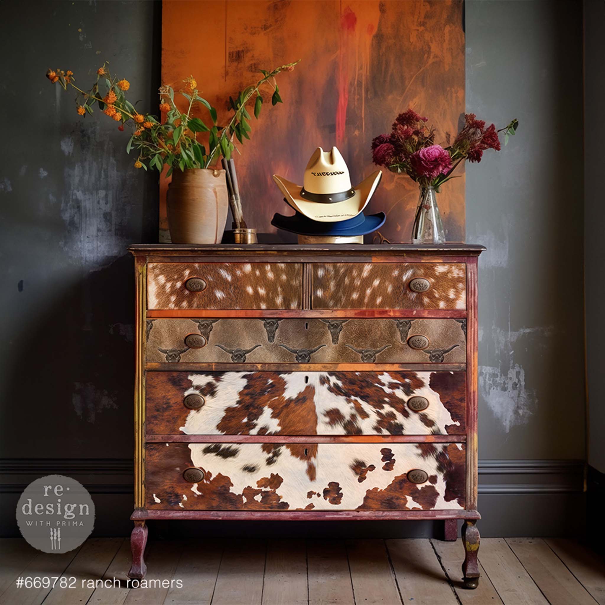 A vintage 5-drawer dresser is painted in a blend of browns and features ReDesign with Prima's Ranch Roamers tissue paper on the drawers.