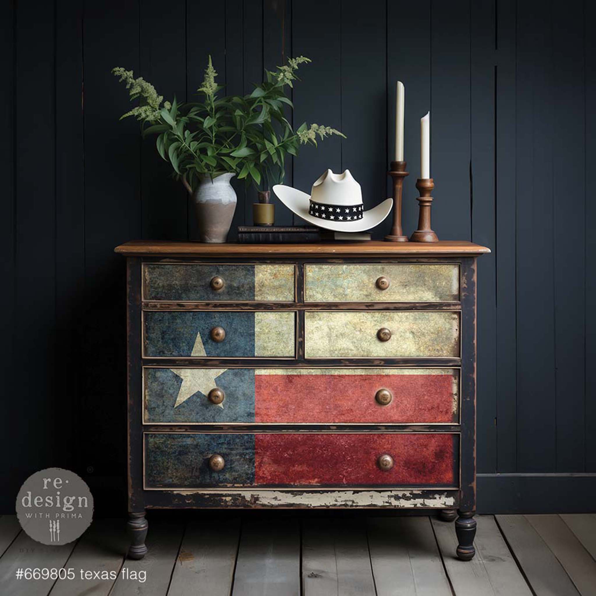 A vintage 6-drawer dresser is painted a weathered dark blue and features ReDesign with Prima's Texas flag A1 fiber paper on its drawers.