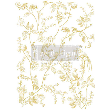 Rub-on transfer design that features gold foil vine-like branches with birds and flowers on it is on a white background.