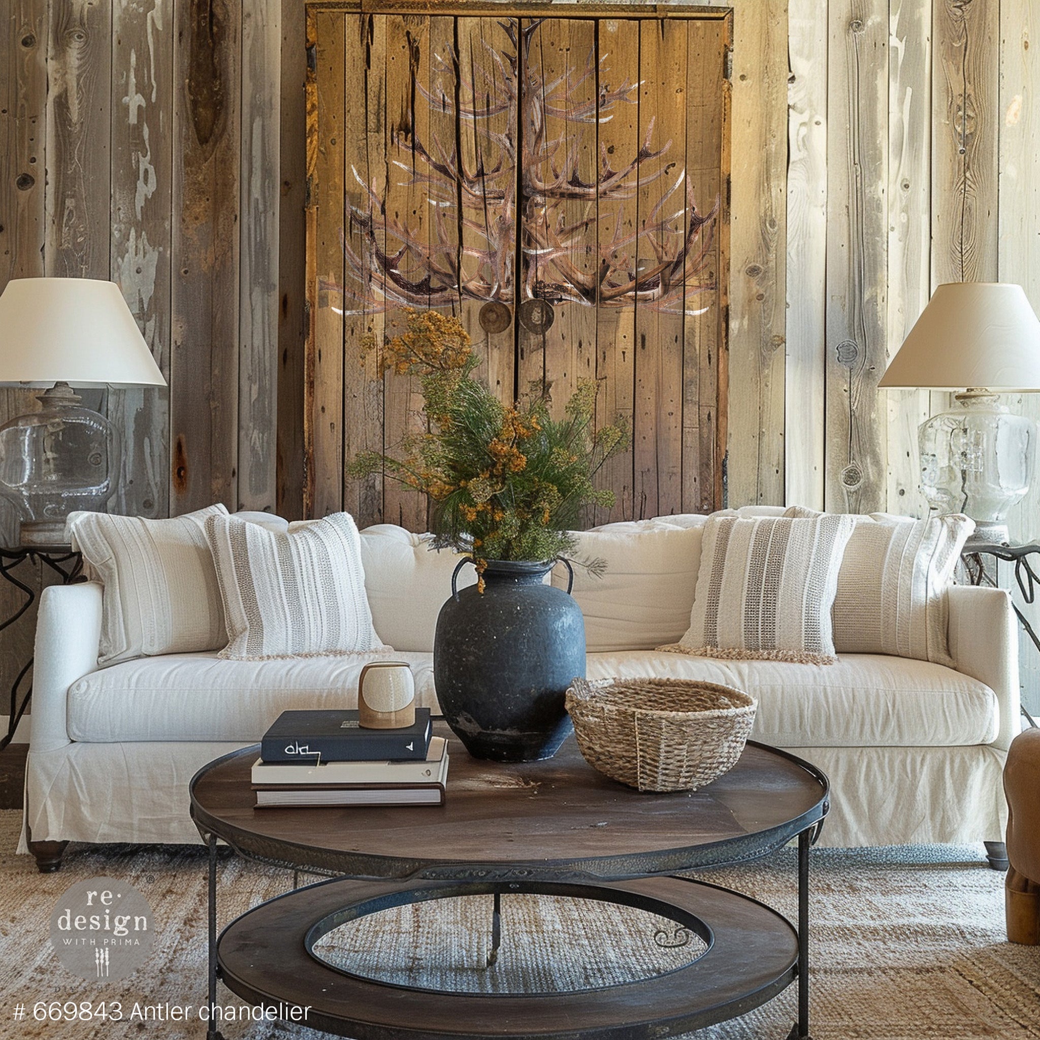 A wood panel armoire behind a white couch features ReDesign with Prima's Antler Chandelier transfer on it.