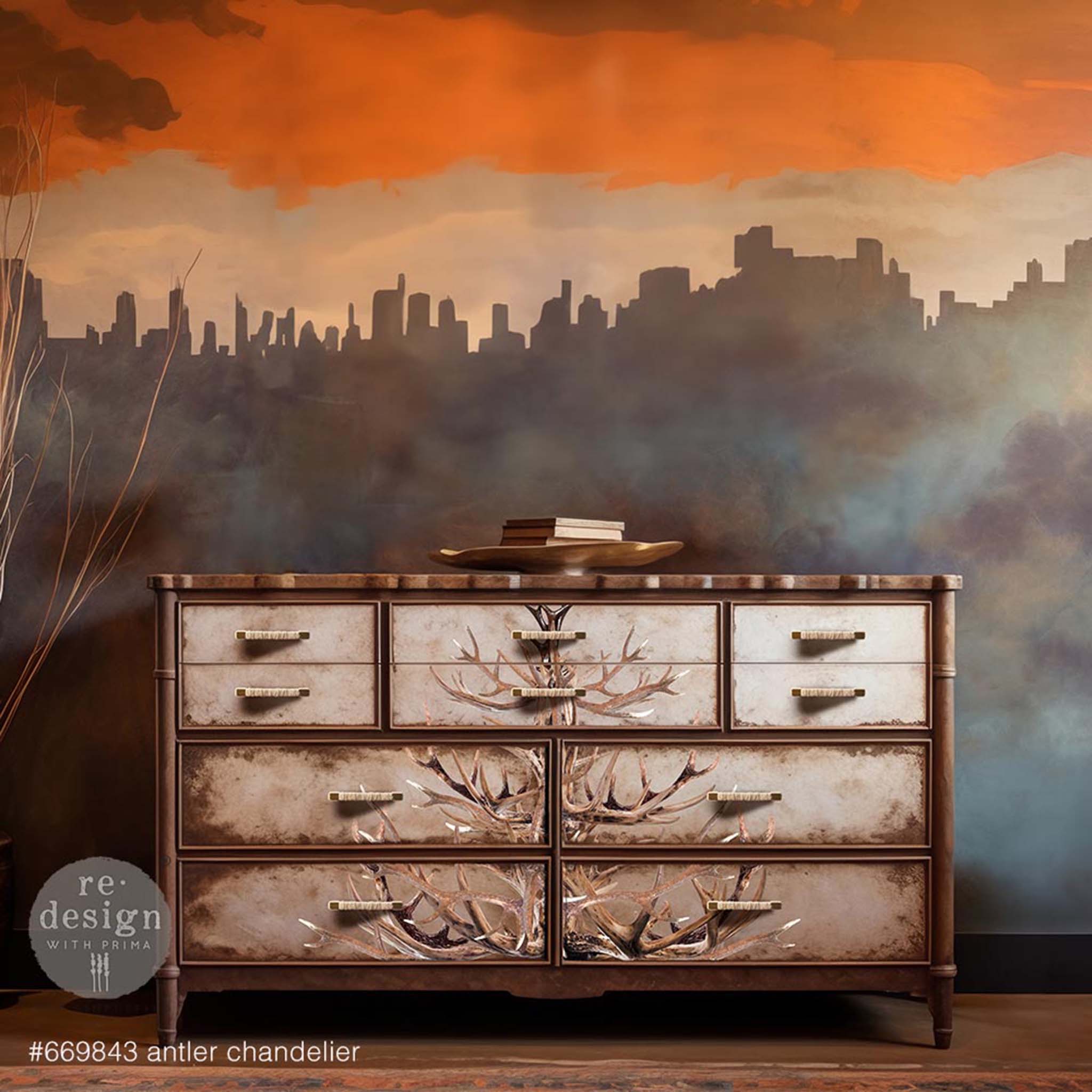 A vintage 10-drawer dresser is painted brown and features ReDesign with Prima's Antler Chandelier transfer down the center of the drawers.