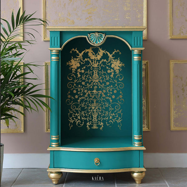 A teal and gold open side table refurbished by Kacha features Manor Swirls inside the backboard.