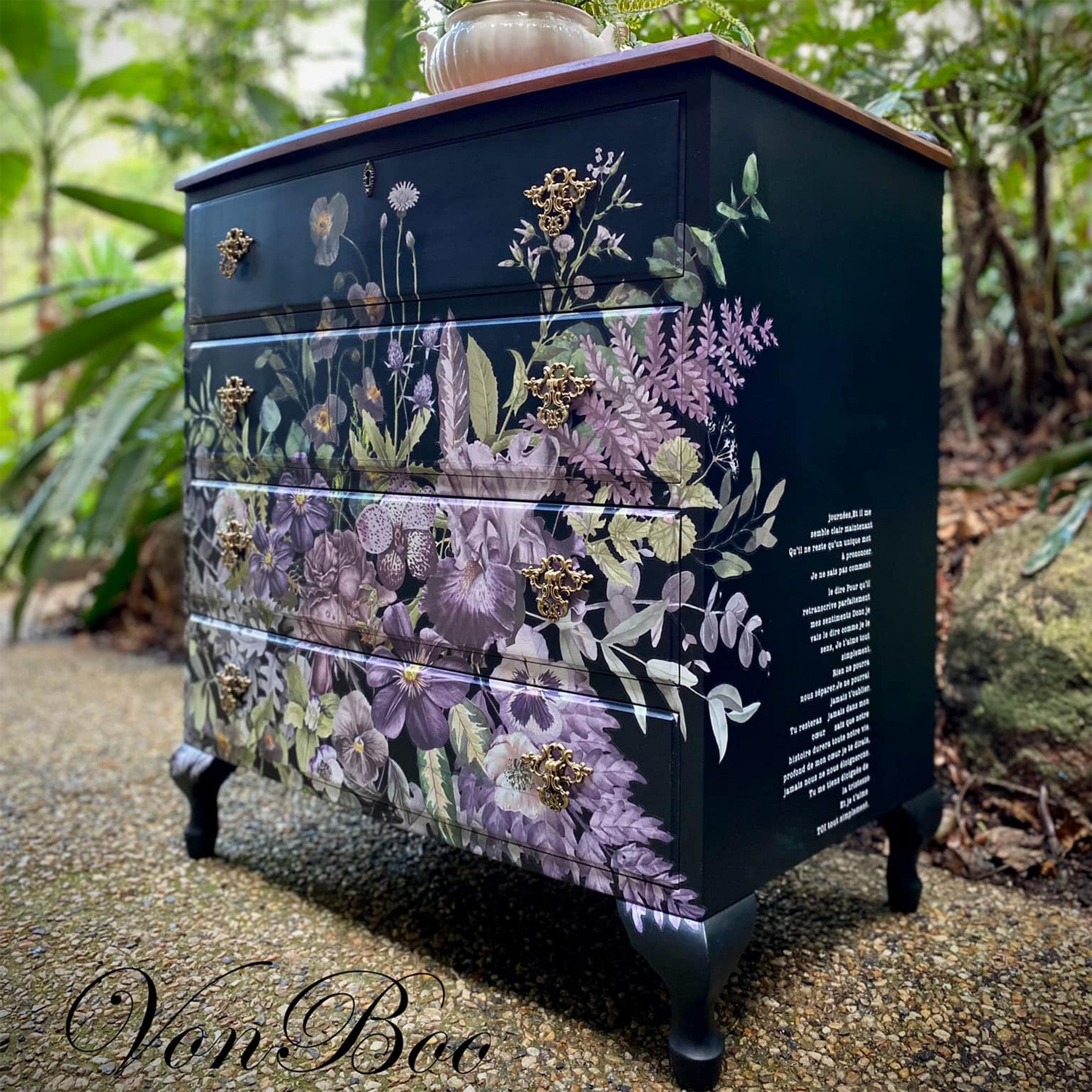 A vintage 4-drawer dresser refurbished by Von Boo is painted navy blue and features ReDesign with Prima's Vigorous Violet rub on transfer on it.