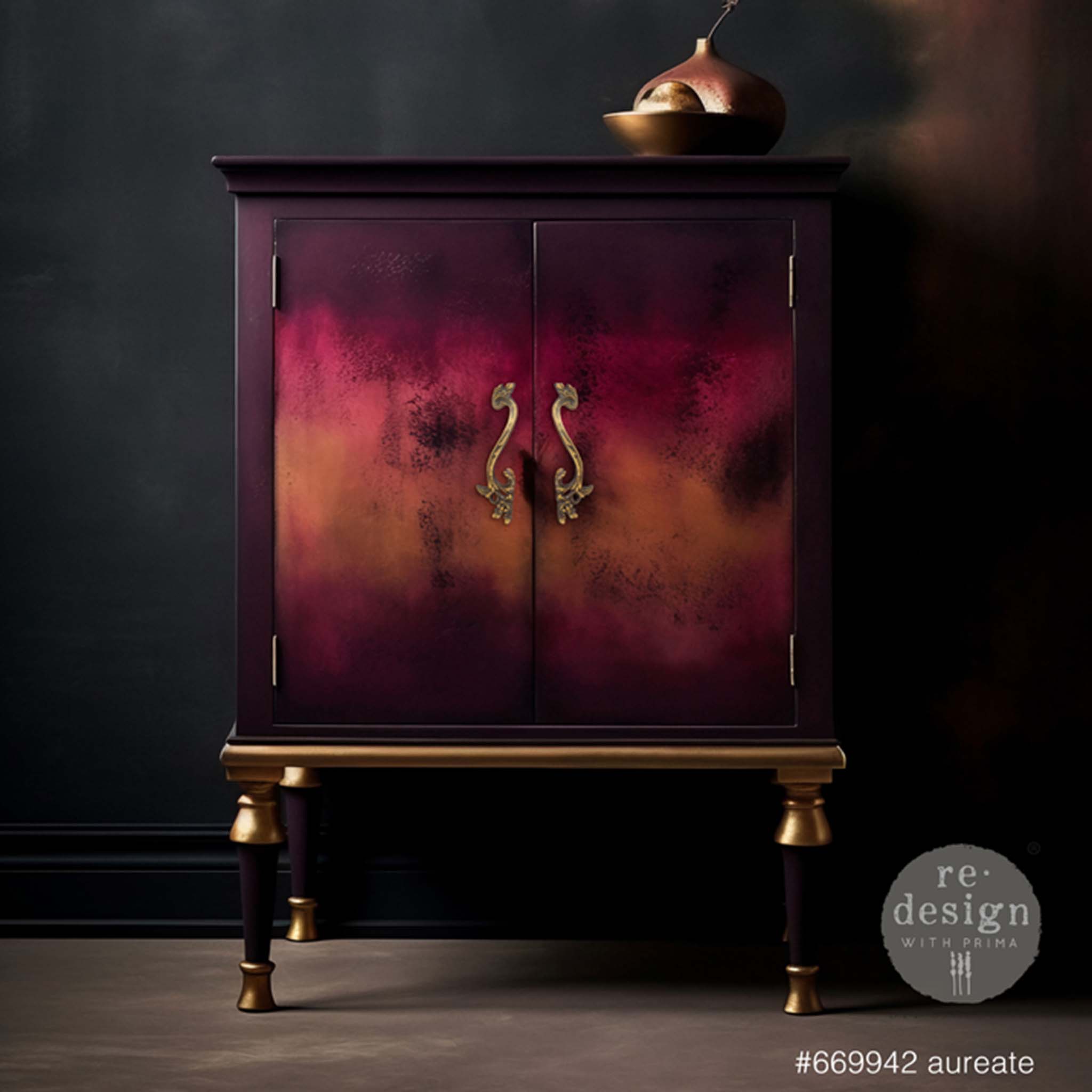 A vintage storage bar cabinet is painted dark plum with an ombre of pink and orange on the doors that feature ReDesign with Prima's Kacha Aureate metal drawer pulls.