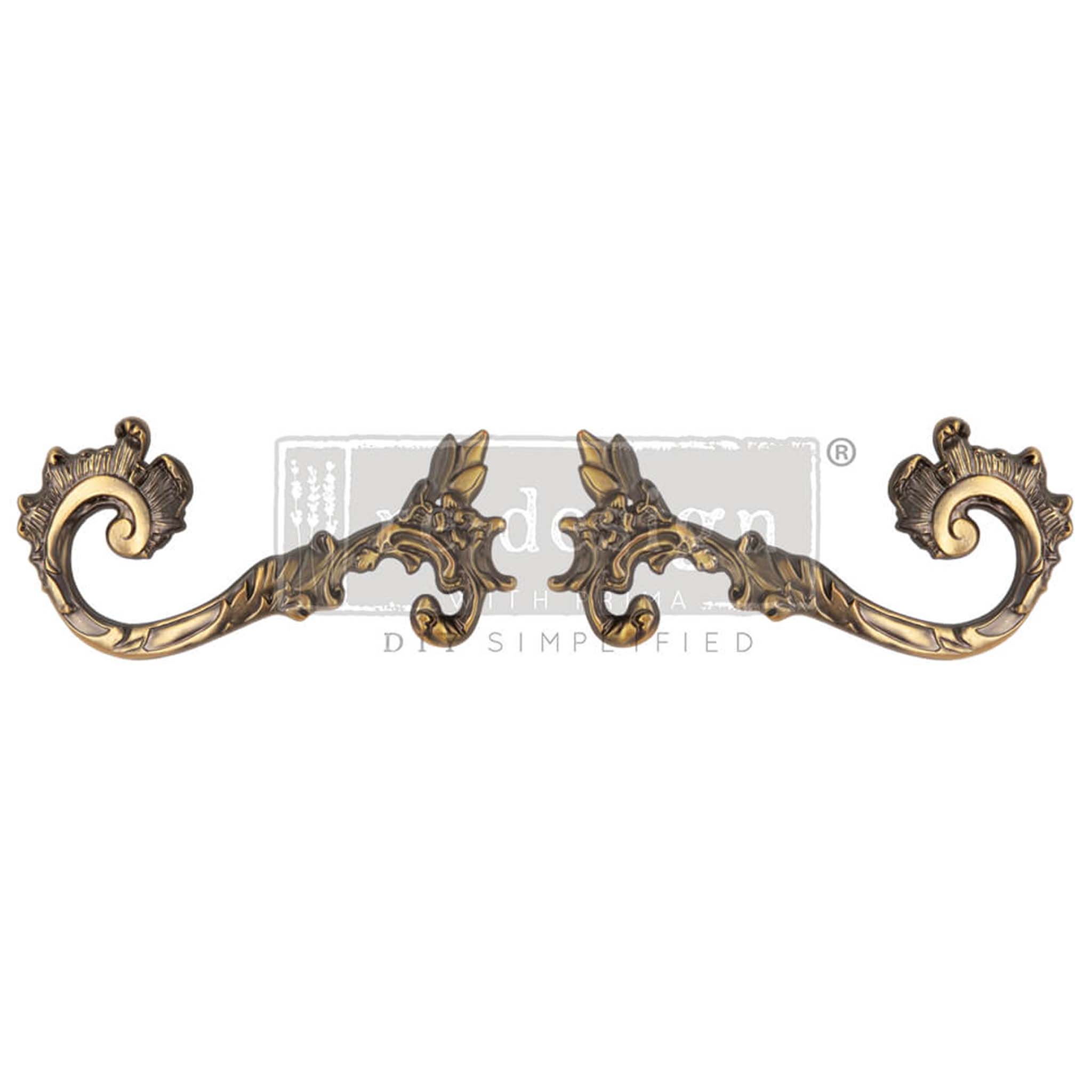 Two metal drawer pulls featuring swirling flourished and floral details are against a white background.