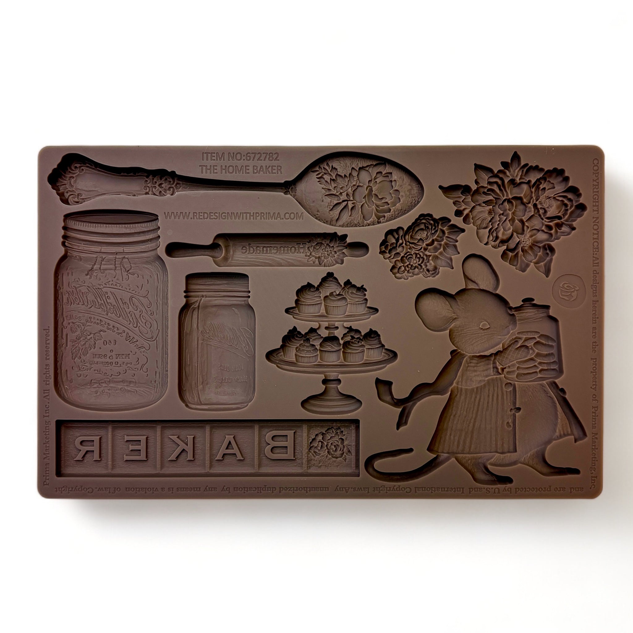 A brown silicone mold featuring  a small baker mouse with vintage kitchen baking items and 2 small floral bouquets is against a white background.