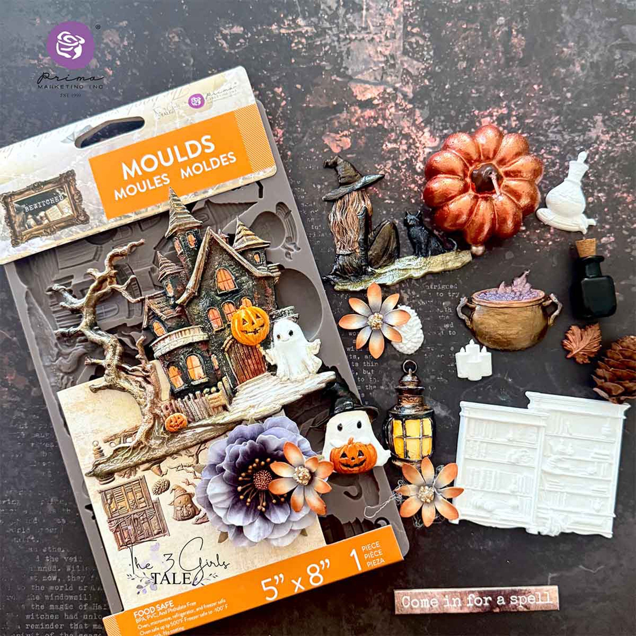 Halloween-themed mold set with decorative items on a dark surface