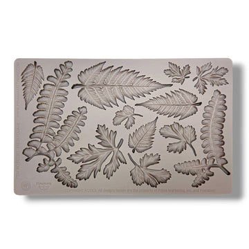 Silicone mold with leaf patterns on a white background