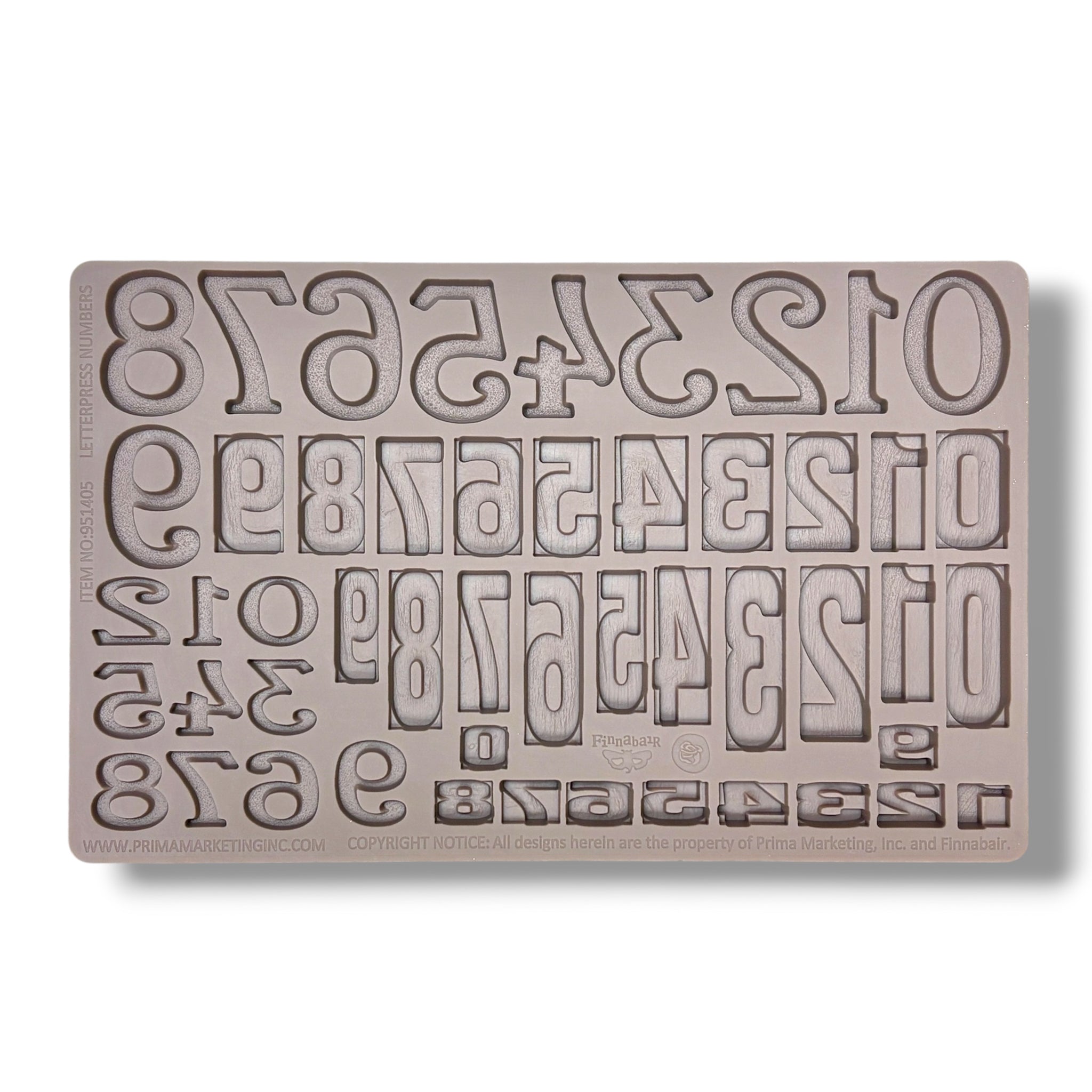 Silicone mold with letter and number stamps on a white background