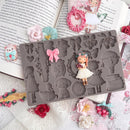 Silicone mold with decorative elements on a floral background