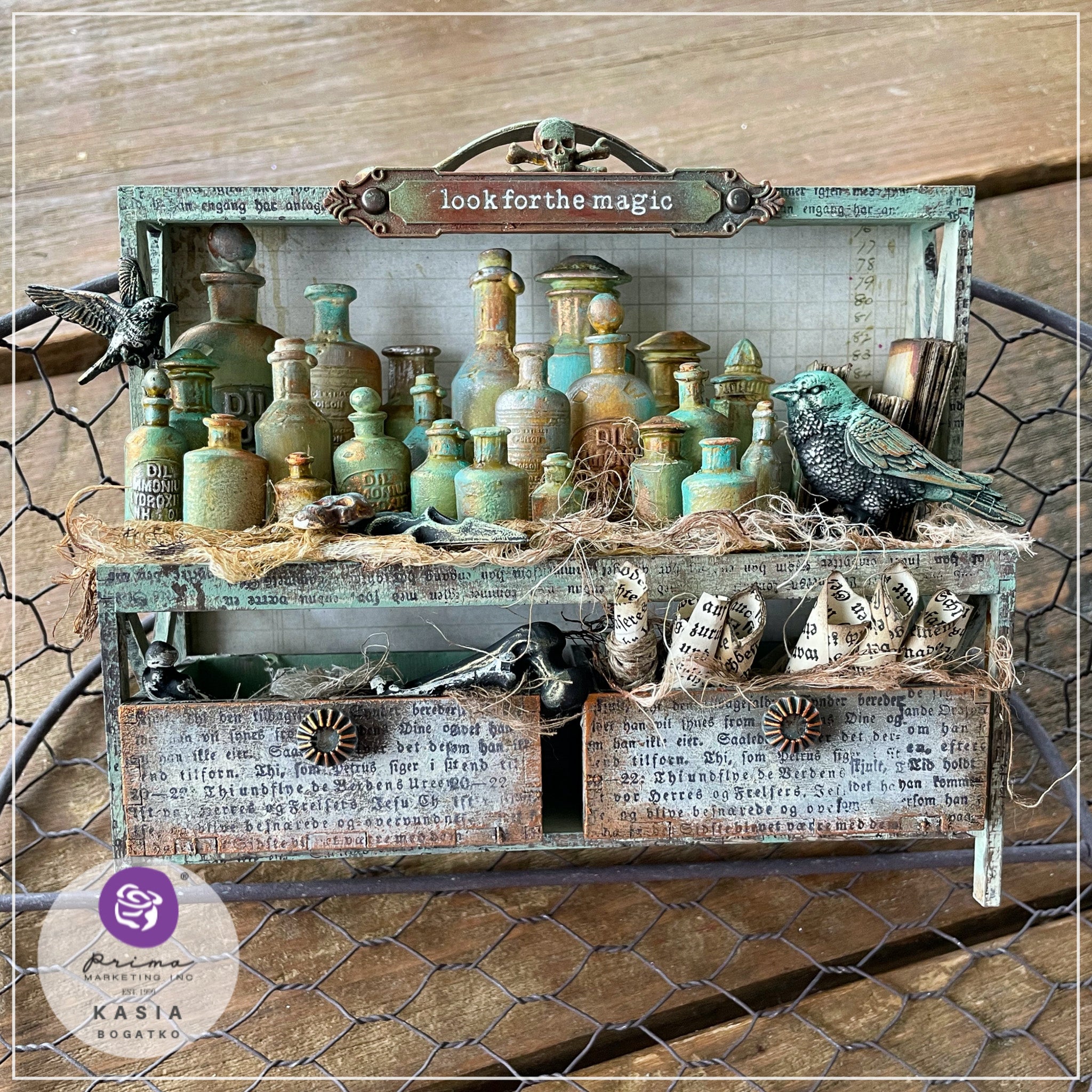 Rustic patina-colored silicone mold castings from Finnabair's Apothecary Bottles Silicone Mold are set up on a spooky decorated shelf