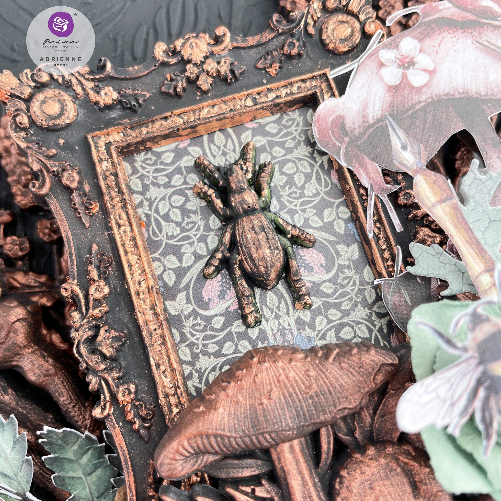 A bronze colored bug and cluster of mushrooms from Prima Marketing's Nature Academia silicone mold are featured on an antique picture frame.